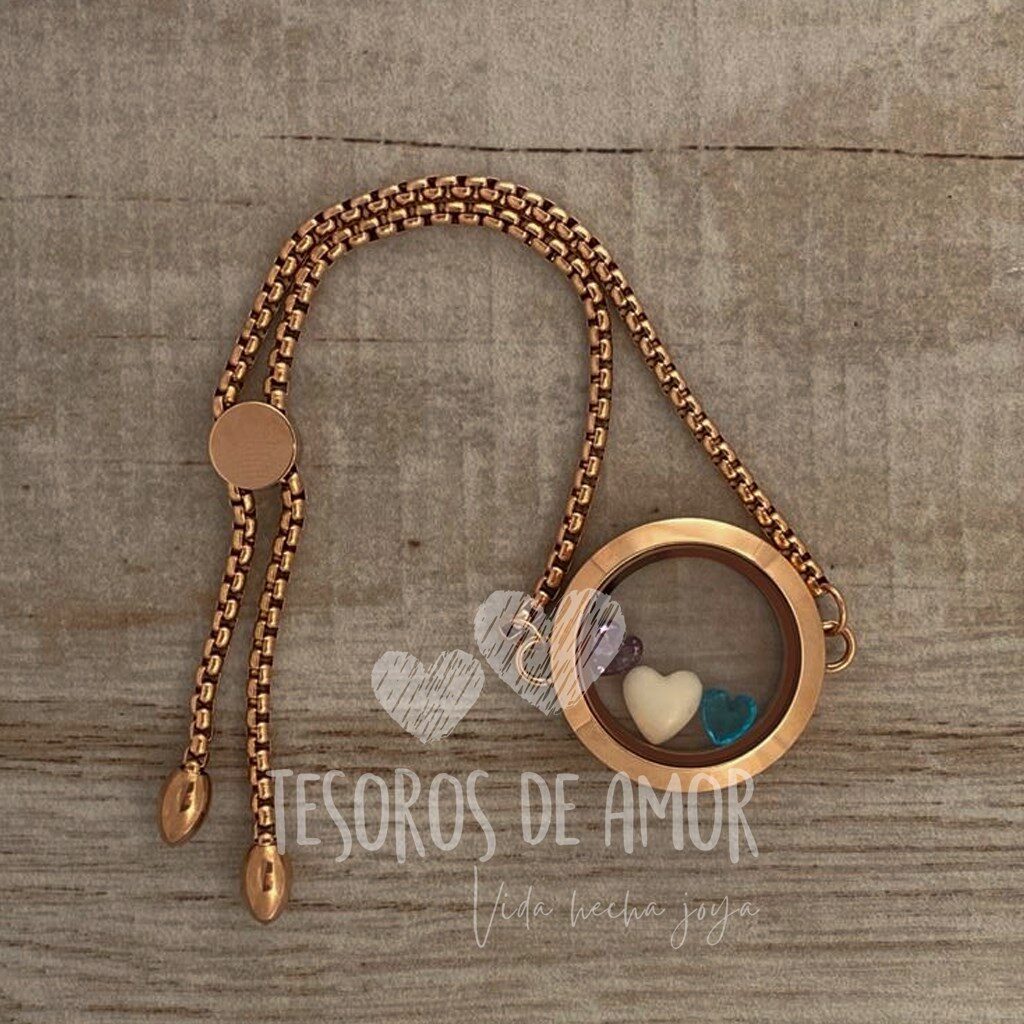 Relicario liso brazalete oro rosa con figura “corazón” blanco y azul; piedra del mes