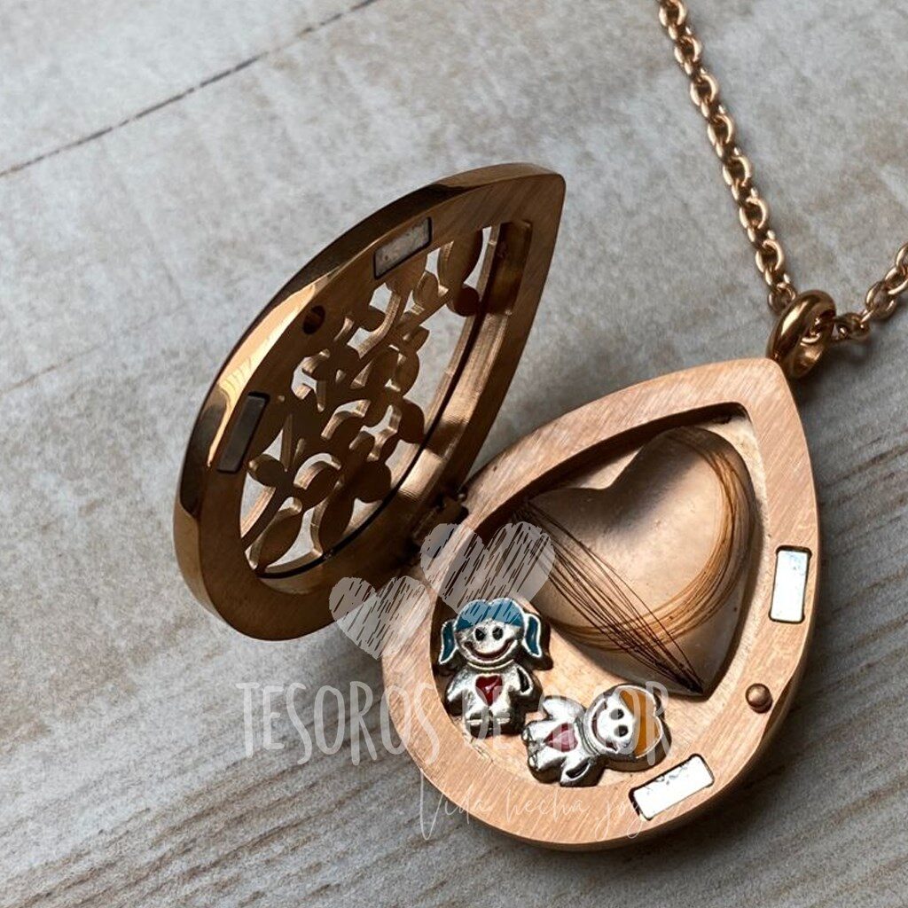 Relicario gota oro rosa con piezas metálicas niño y niña con figura corazón con cabello