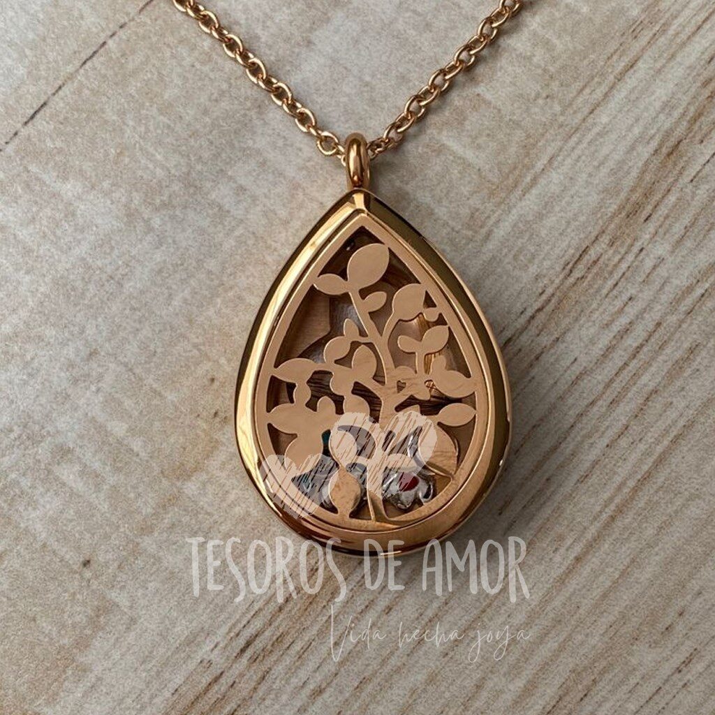 Relicario gota oro rosa con piezas metálicas niño y niña con figura corazón con cabello