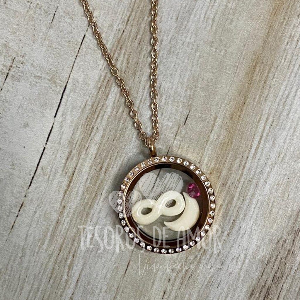 Relicario redondo oro rosa brillos con figuras de leche infinito y luna con piedra del mes