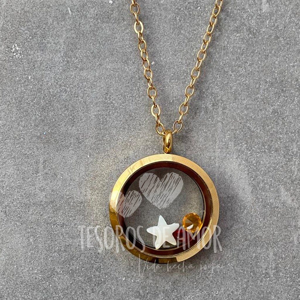 Relicario liso dorado con figura de leche “estrella” y piedras del mes
